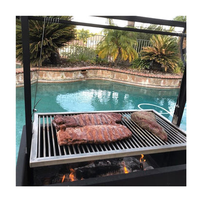 Residential grill for wood or charcoal