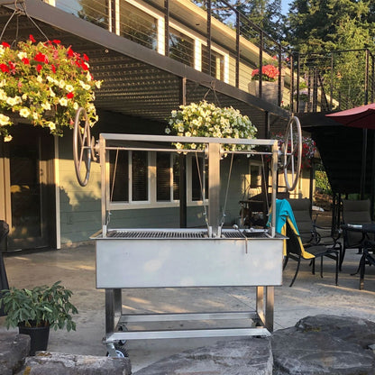 Santa Maria Stainless Steel Grill with Rotisserie in outside setting