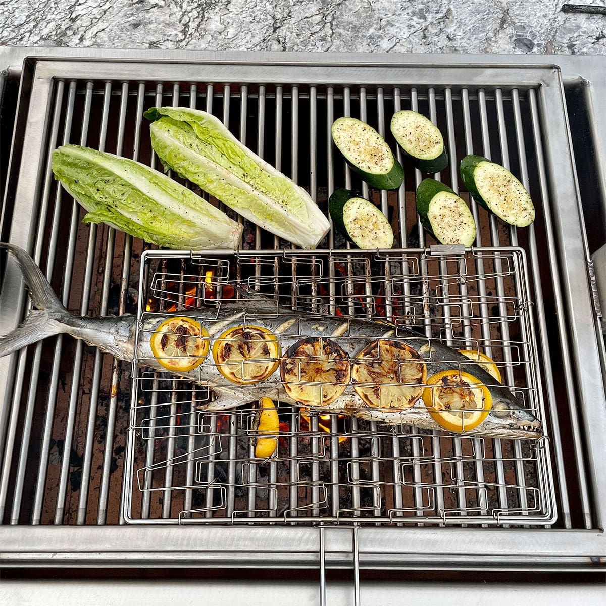How to cook fish over a wood fire using a Santa Maria grill with an Argentine grate