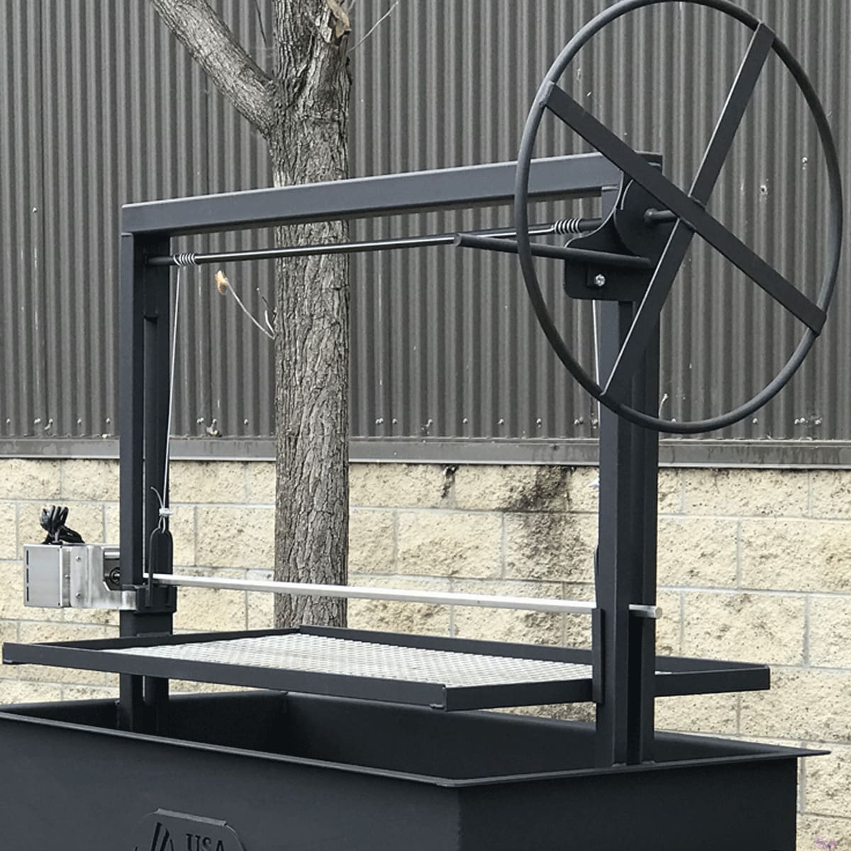 Single crank Santa Maria grill with large hand wheel.