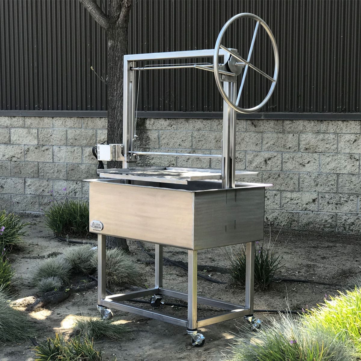 Wood grill with large wheel in all stainless.