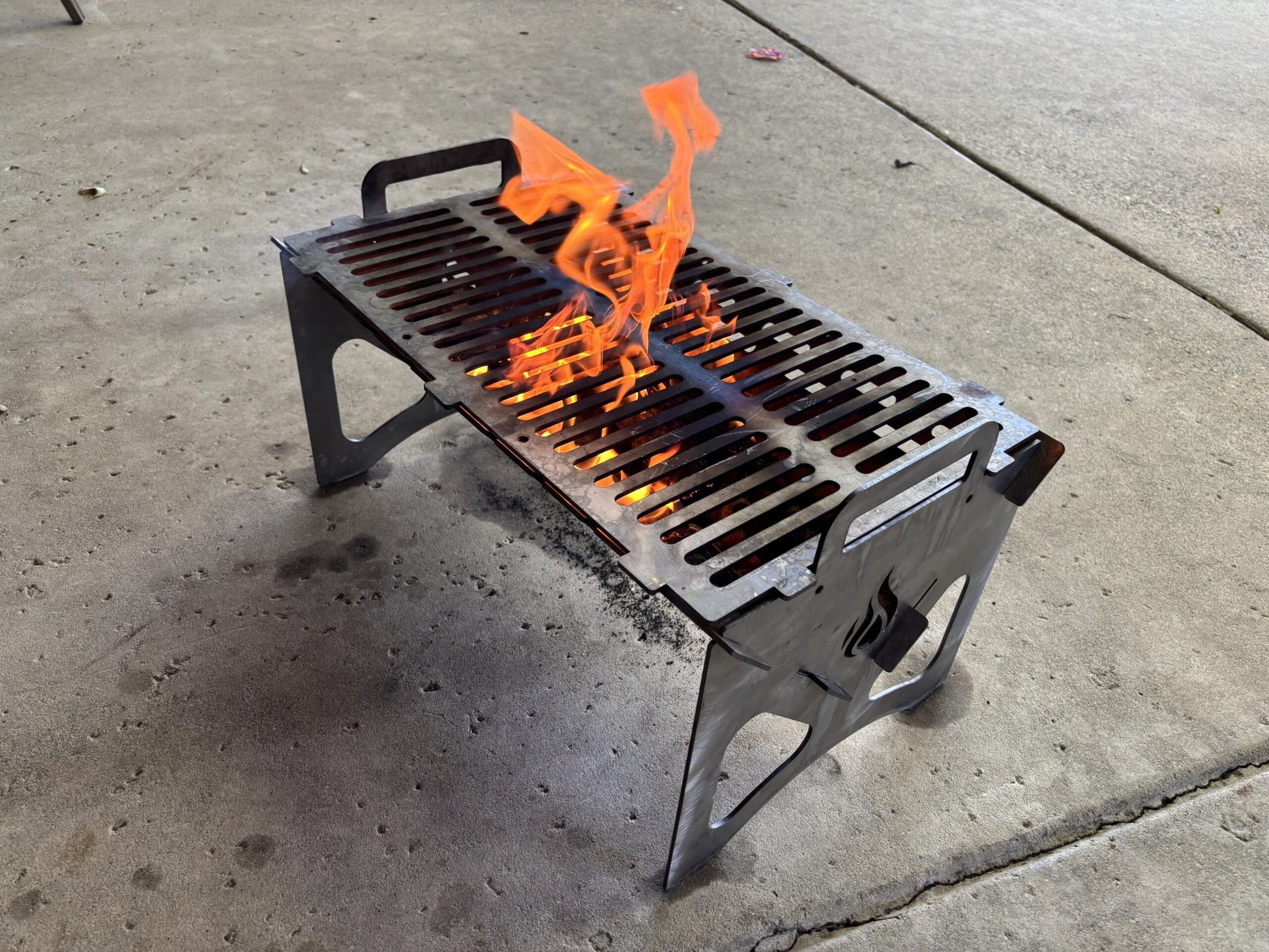 Portable Steel Hibachi Grill that folds up.