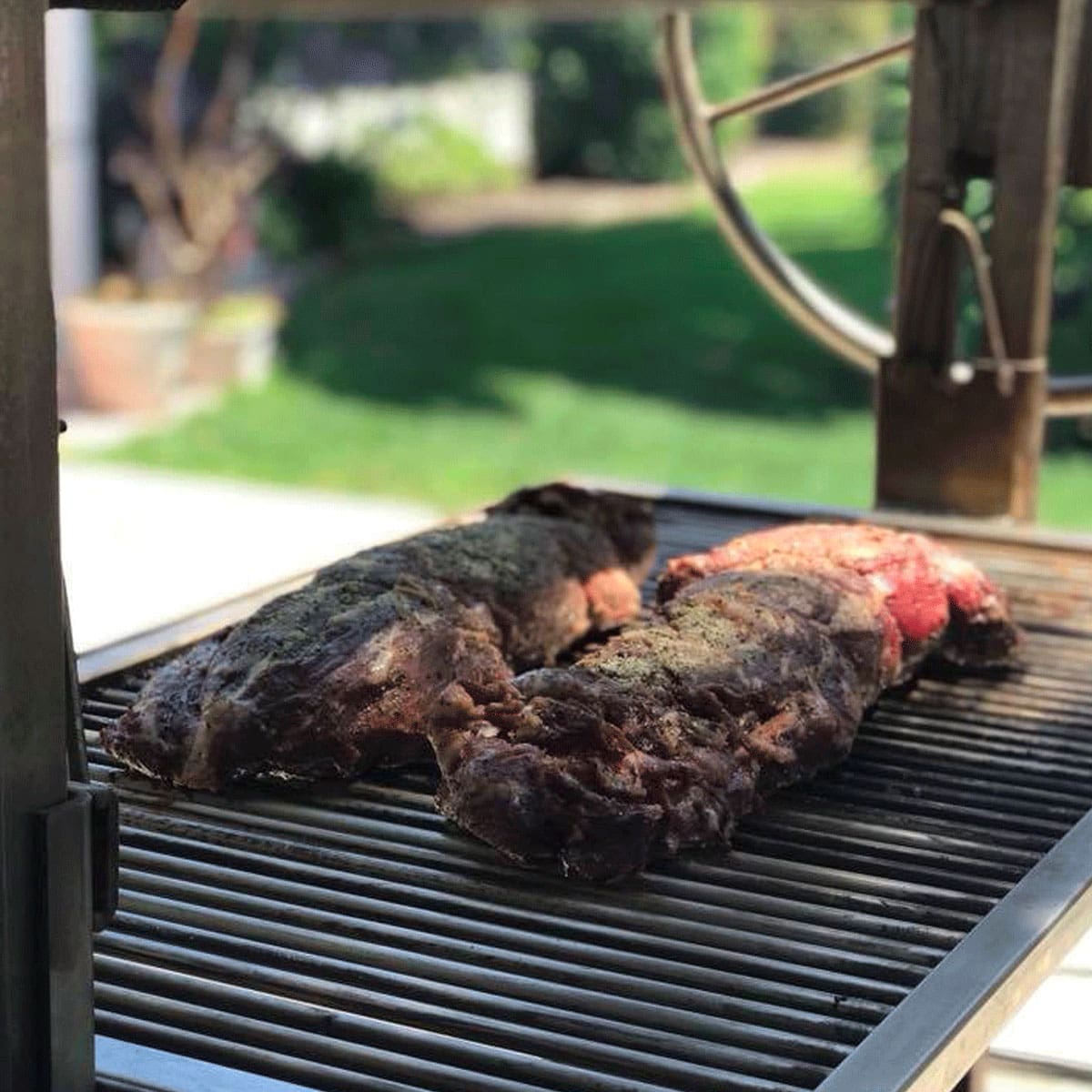 Grilling steaks on a built in Santa Maria grill