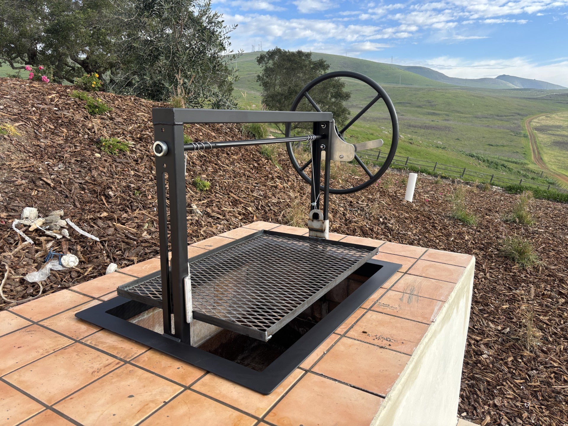 Black Santa Maria Grill installed in Island with ranch in background 