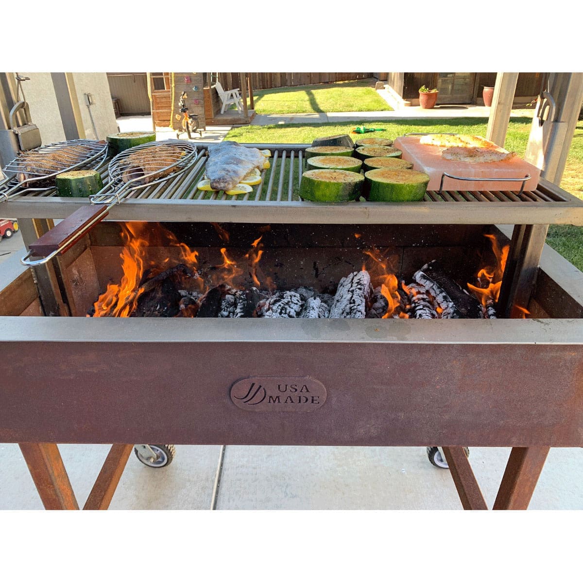 Cooking fish over an open fire on an Argentine grill