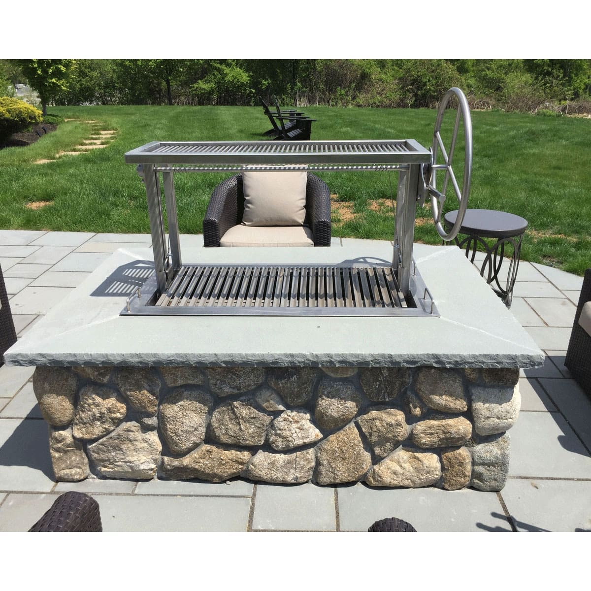 Stainless Argentine Style Campfire Gaucho grill in a firetable